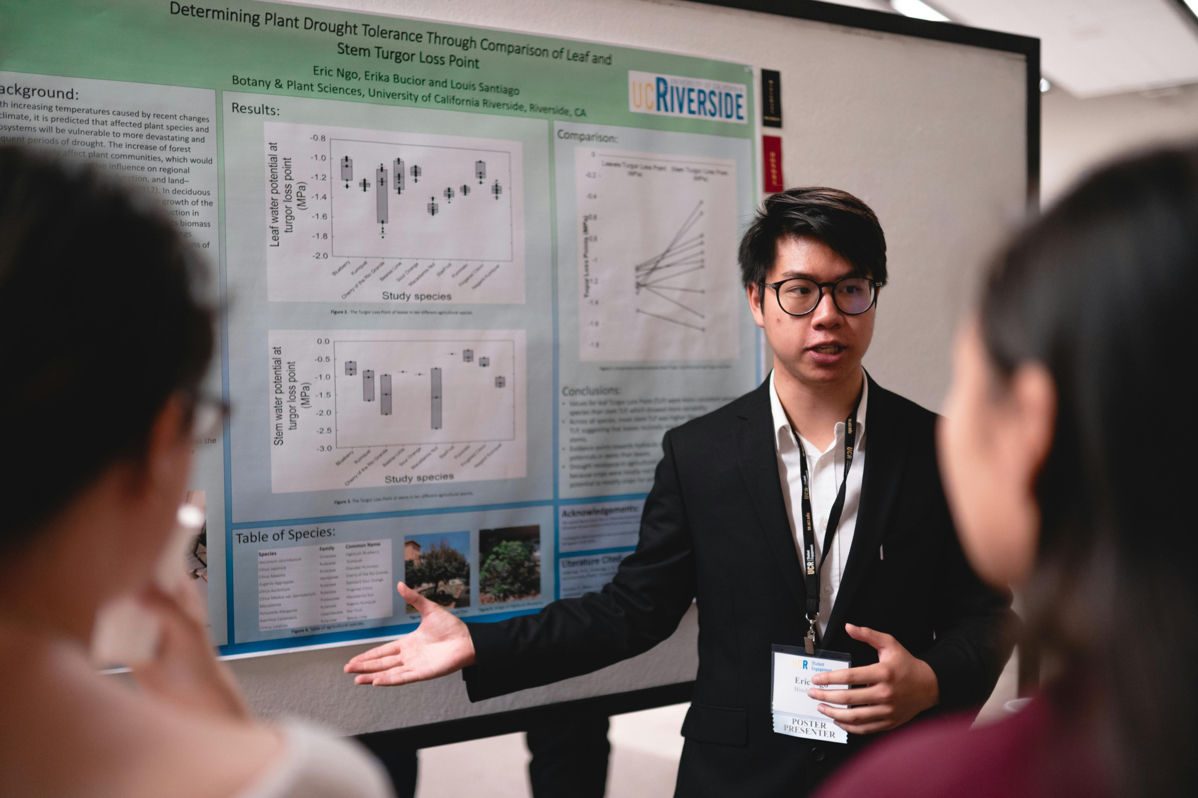 A researcher giving a poster presentation